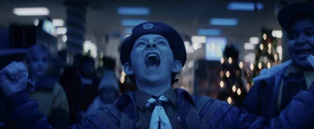 A kid celebrates playing Nintendo