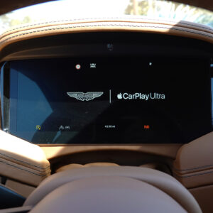 Aston Martin dashboard showing CarPlay ultra logo