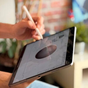 A man operates Blender on a tablet with a stylus