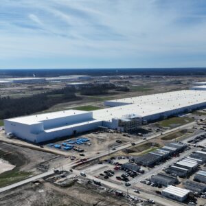 An aerial view of a battery factory and its surroundings.