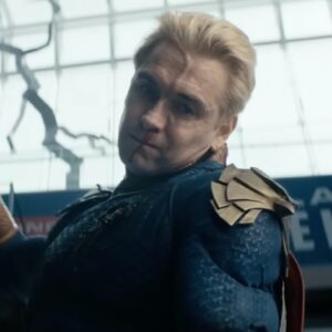 homeland with blood spattered face and raised fist about to rain down blows on an unseen opponent.