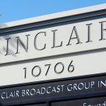A corporate building with a sign that says, "Sinclair Broadcast Group, Inc."