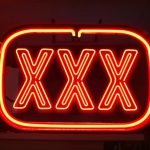 Red neon light of triple X's.