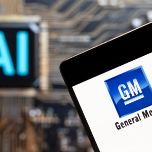 CHINA - 2023/11/03: In this photo illustration, the American multinational automobile corporation, the General Motors (GM, NYSE: GM) logo seen displayed on a smartphone with an Artificial intelligence (AI) chip and symbol in the background.