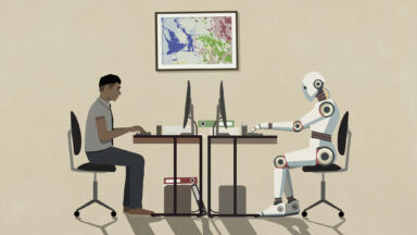 Man and humanoid robot working face to face at computers