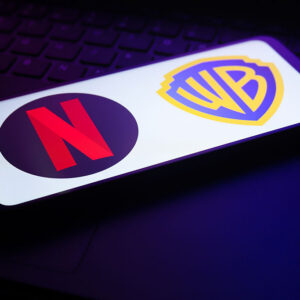 The Netflix and Warner Bros. Discovery app logo appears on the screen of a smartphone in Reno, United States, on December 5, 2025.