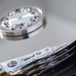 Image of silvery disks and small pivoting arms.