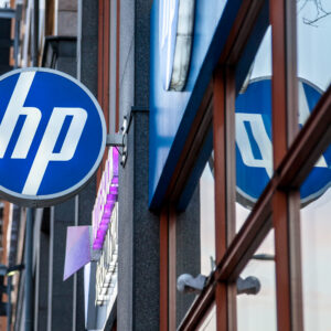 Picture of an HP Shop sign on their main store in Budapest, Hungary. HP, formerly Hewlett Packard, is an American technology company which develops personal computers (PCs), printers and related supplies, as well as 3D solutions