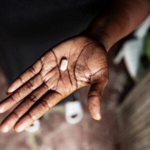 Picture of an ARV tablet in someone's hand