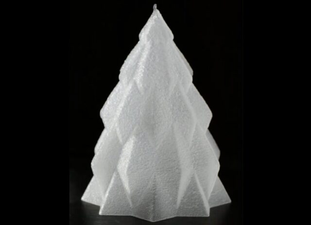 Christmas tree made of ice against a black background