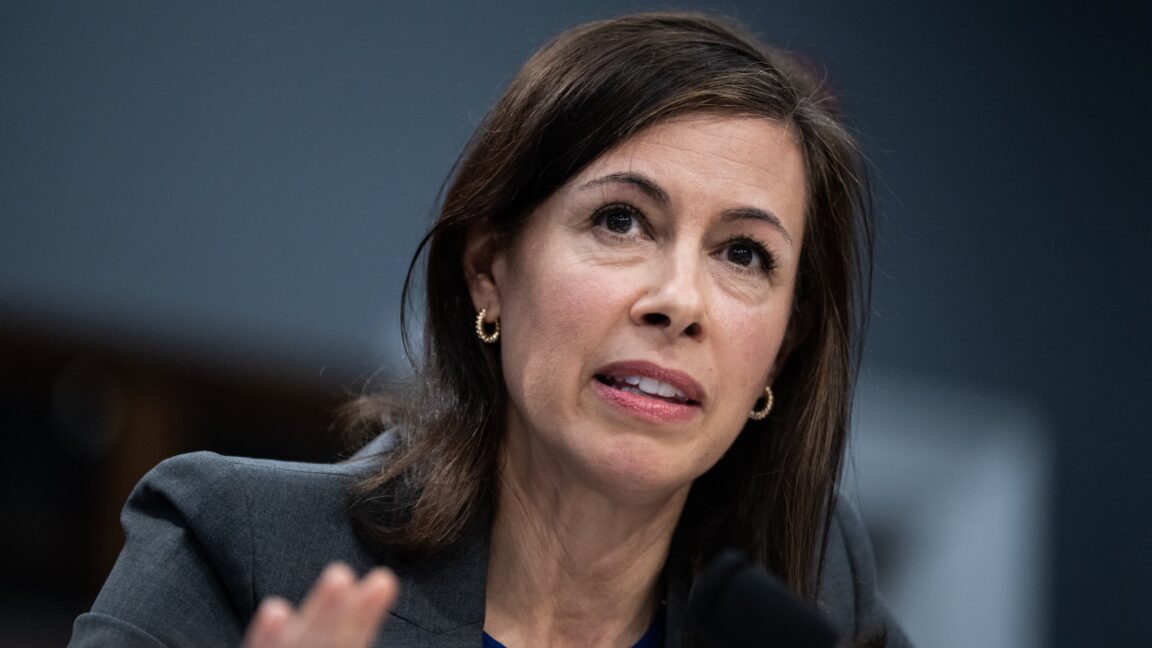 FCC Chairwoman Jessica Rosenworcel sits in front of a microphone while testifying during a Congressional hearing.
