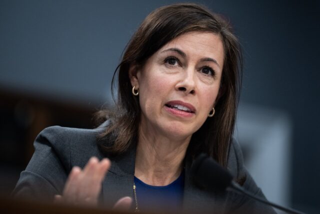 FCC Chairwoman Jessica Rosenworcel sits in front of a microphone while testifying during a Congressional hearing.