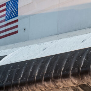 a close-up of the side of a space shuttle orbiter, including a marking show a reverse (or backwards) American flag