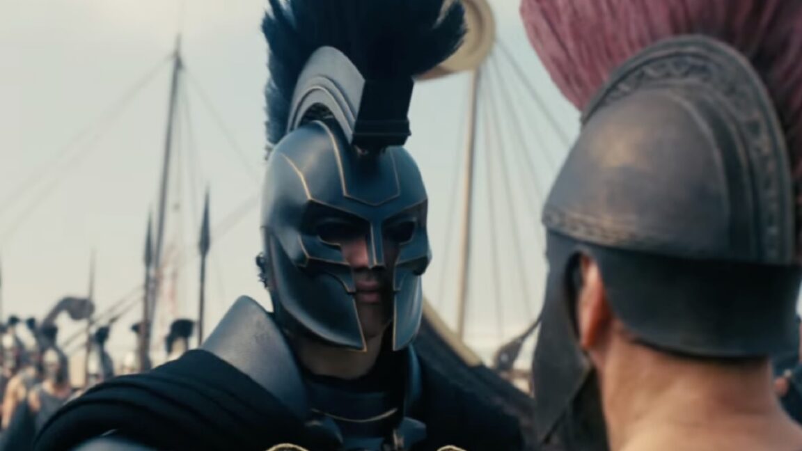 Ithacan king in full armor facing defeated foe on battlefield