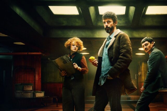 group of people I'm an underground office sanding around a desk